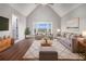 Cozy living room with large bay window, comfortable seating, and hardwood floors at 448 Buckingham Dr, Marietta, GA 30066