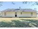 Back of house boasts backyard, stone patio and neutral siding at 835 Old Rocky Rd, Atlanta, GA 30349