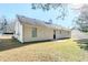 Exterior view of home with partial fence and green grass at 835 Old Rocky Rd, Atlanta, GA 30349