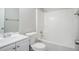 Spotless bathroom with a shower-tub combination and a vanity with ample storage at 835 Old Rocky Rd, Atlanta, GA 30349
