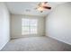 Bedroom featuring natural light, ceiling fan, and neutral colored carpet at 835 Old Rocky Rd, Atlanta, GA 30349