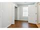 Bedroom featuring natural lighting, wood floors, and neutral walls at 835 Old Rocky Rd, Atlanta, GA 30349