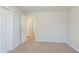 Bedroom featuring natural lighting, neutral paint, and carpet flooring at 835 Old Rocky Rd, Atlanta, GA 30349
