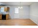 Bright dining room features hardwood floors and traditional lighting at 835 Old Rocky Rd, Atlanta, GA 30349