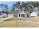 Charming single-story home featuring a well-maintained lawn and a classic exterior with black shutters at 835 Old Rocky Rd, Atlanta, GA 30349