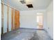 Unfinished garage with exposed framing and a painted floor at 835 Old Rocky Rd, Atlanta, GA 30349