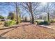 This backyard is spacious with several trees at 2506 Maple St, East Point, GA 30344