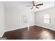 This bedroom features hardwood floors, trim, and two windows at 2506 Maple St, East Point, GA 30344