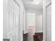 A clean hallway features white trim and doors, hardwood flooring, and neutral paint at 2506 Maple St, East Point, GA 30344