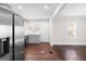 Modern kitchen featuring stainless steel appliances, light gray cabinetry, and hardwood floors at 2506 Maple St, East Point, GA 30344