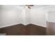 An empty living room featuring hardwood flooring and neutrally painted walls at 2506 Maple St, East Point, GA 30344