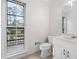 Bathroom with tile floors, white vanity, and a large window allowing plenty of natural light at 2533 Briers North Dr, Atlanta, GA 30360