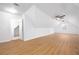 Spacious bonus room with fresh paint, light colored-wood floors, and attached bath at 2533 Briers North Dr, Atlanta, GA 30360