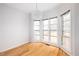 Sunlit dining area featuring hardwood floors, modern chandelier, and large windows at 2533 Briers North Dr, Atlanta, GA 30360