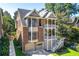 Beautiful home featuring a well-manicured lawn and a unique double-decker porch design at 2533 Briers North Dr, Atlanta, GA 30360