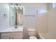 Bright bathroom showcasing a white vanity, toilet, and shower-tub combo at 3291 Quincey Xing, Conyers, GA 30013