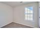 Cozy bedroom with carpet floors and a bright window at 3291 Quincey Xing, Conyers, GA 30013