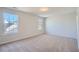 Spacious bedroom featuring natural light from two bright windows at 3291 Quincey Xing, Conyers, GA 30013