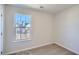 Cozy bedroom featuring a bright window and neutral carpeting at 3291 Quincey Xing, Conyers, GA 30013