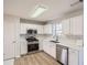 Bright kitchen featuring stainless steel appliances, white cabinets, and modern countertops at 3291 Quincey Xing, Conyers, GA 30013