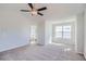 Spacious bedroom featuring vaulted ceiling, ceiling fan, and large windows at 3291 Quincey Xing, Conyers, GA 30013