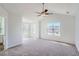 Spacious bedroom featuring vaulted ceiling, ceiling fan, and large windows at 3291 Quincey Xing, Conyers, GA 30013