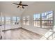 Sunroom with vaulted ceiling, ceiling fan, and outdoor views through large windows at 3291 Quincey Xing, Conyers, GA 30013