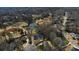 Beautiful neighborhood aerial view featuring tree-lined streets, luxury homes, and a scenic pond at 1460 Lakemist Ct, Roswell, GA 30075