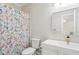 Charming bathroom with a stylish vanity and a colorful butterfly-themed shower curtain at 1460 Lakemist Ct, Roswell, GA 30075