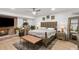 A comfortable main bedroom features a fireplace, TV, and large mirror at 1460 Lakemist Ct, Roswell, GA 30075