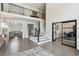 The foyer features high ceilings, hardwood floors, a staircase, and is open to the living room at 1460 Lakemist Ct, Roswell, GA 30075