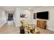 Modern living room features stylish decor, hardwood floors, and a basketball hoop for added entertainment at 1460 Lakemist Ct, Roswell, GA 30075