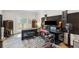 Bright music room has recording equipment, a keyboard, and natural light from a glass door at 1460 Lakemist Ct, Roswell, GA 30075