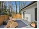 Charming outdoor deck with cozy seating and tranquil garden views, creating a relaxing retreat at 1460 Lakemist Ct, Roswell, GA 30075