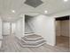 A newly renovated basement entryway with gray and white floors at 1460 Lakemist Ct, Roswell, GA 30075