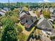 Aerial view of a residential neighborhood with lush greenery and well-maintained homes at 2528 Picket Fence Ln, Snellville, GA 30078