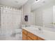 Bathroom with tiled floor featuring a sink, shower and toilet at 2528 Picket Fence Ln, Snellville, GA 30078