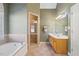 Bathroom features a separate shower, garden tub, and dual sink vanity at 2528 Picket Fence Ln, Snellville, GA 30078