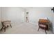 Bedroom featuring neutral walls, light carpet, and furniture at 2528 Picket Fence Ln, Snellville, GA 30078