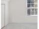 Small bedroom with carpet floor, window and closet at 2528 Picket Fence Ln, Snellville, GA 30078