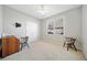 Cozy bedroom featuring carpeted floors, a ceiling fan, and a bright window at 2528 Picket Fence Ln, Snellville, GA 30078