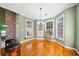 Bright dining area with hardwood floors, large windows, and chandelier lighting at 2528 Picket Fence Ln, Snellville, GA 30078