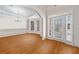 Dining room featuring hardwood floors, tray ceiling, and bay window at 2528 Picket Fence Ln, Snellville, GA 30078