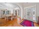 Elegant dining room with hardwood floors, chandelier, and large windows at 2528 Picket Fence Ln, Snellville, GA 30078