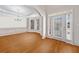 Bright foyer with hardwood floors, elegant chandelier, and decorative wall trim at 2528 Picket Fence Ln, Snellville, GA 30078