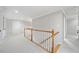 Upstairs hallway with white carpet and staircase at 2528 Picket Fence Ln, Snellville, GA 30078