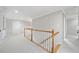 Upstairs hallway featuring white banister and access to the various rooms at 2528 Picket Fence Ln, Snellville, GA 30078