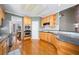Well-equipped kitchen with hardwood floors, wooden cabinets, and modern appliances at 2528 Picket Fence Ln, Snellville, GA 30078