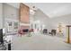 Bright living room featuring a brick fireplace and open floor plan at 2528 Picket Fence Ln, Snellville, GA 30078