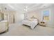 Large main bedroom featuring a tray ceiling, carpeted floor, and lots of space at 2528 Picket Fence Ln, Snellville, GA 30078
